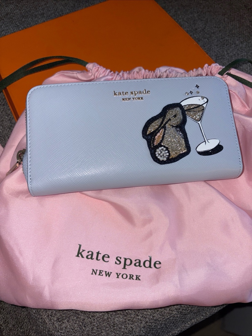 kate spade light blue zip-around wallet with bunny & cocktail patch